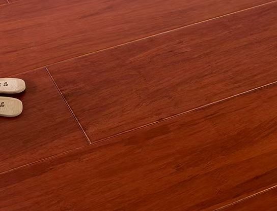 Medium-brown strand-woven bamboo plank close-up showing reddish hue