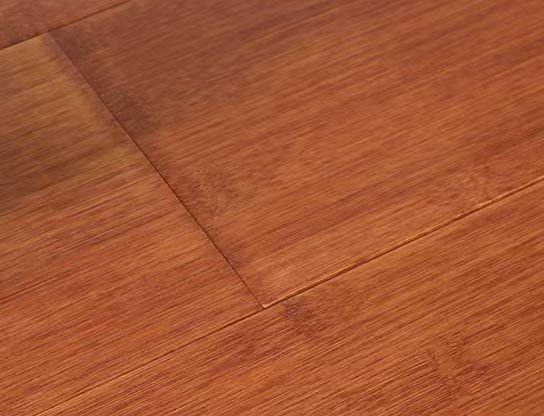 Golden-red strand-woven bamboo plank close-up with warm red undertone