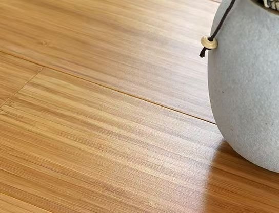 Medium-tone bamboo plank close-up showing pronounced grain pattern