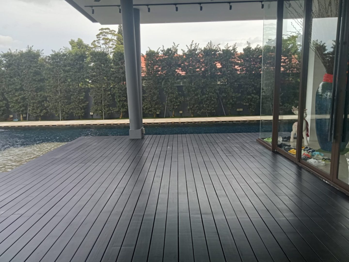 Cassia / Bukit Timah bungalow Chengal decking replacement — existing decking removed, new Chengal boards laid and finished
